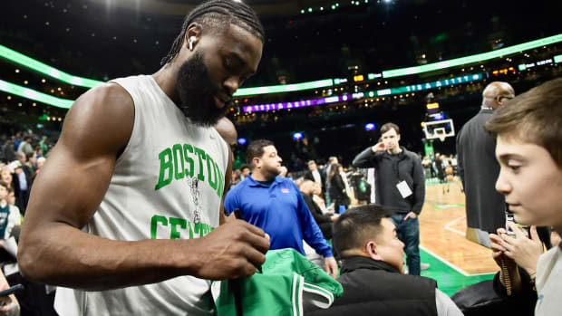 Jaylen Brown signs for a Celtics fan